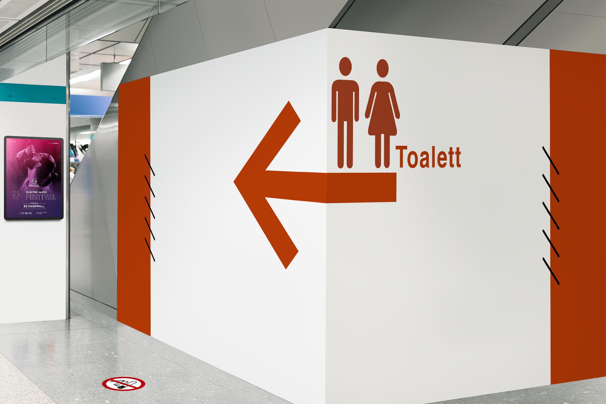 Stor vit skylt med rött tryck visar vägen till toaletterna i ett köpcentrum. På väggen finns en låsbar snäppram A4